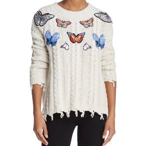 Knit sweater with butterfly patches